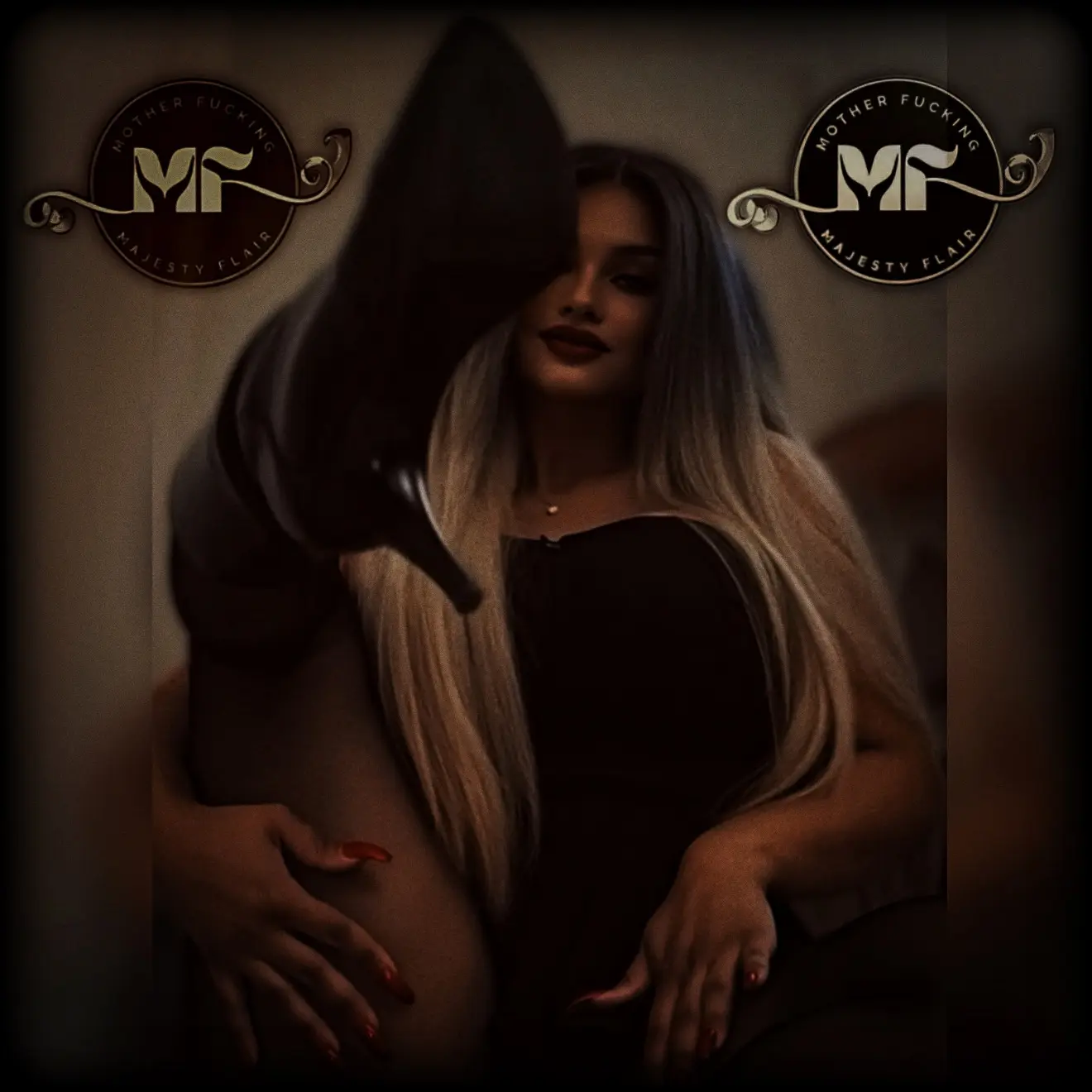 Majesty Flair seated beside the MF emblem